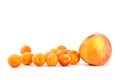 One peach and few apricots Royalty Free Stock Photo