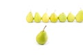 One pear on the background of a row of pears Royalty Free Stock Photo