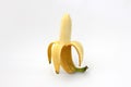 One peeled banana isolated Royalty Free Stock Photo