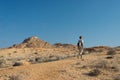 One person hiking in the Namib desert