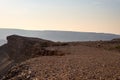 One person looking at the Fish River Canyon, scenic travel destination in Southern Namibia. Expansive view at sunset. Wanderlust t Royalty Free Stock Photo