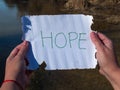 One person reading hope message on a crystal bottle Royalty Free Stock Photo