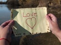 One person reading love message on a crystal bottle Royalty Free Stock Photo