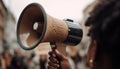 One person shouting, holding megaphone, surrounded by enthusiastic crowd generated by AI Royalty Free Stock Photo