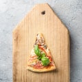 One piece of Italian pizza with tomatoes mushrooms bacon and che Royalty Free Stock Photo