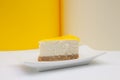 One piece of lemon cheesecake on a white plate. Royalty Free Stock Photo