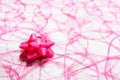 One pink bow on pink sisal Royalty Free Stock Photo