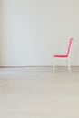 Pink chair in an empty white interior room Royalty Free Stock Photo