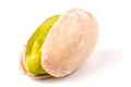 One pistachio on white background close-up macro Royalty Free Stock Photo