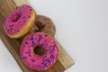 One Plain and Two Pink and Donuts Royalty Free Stock Photo