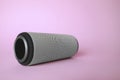 One portable bluetooth speaker on pink background, space for text. Audio equipment Royalty Free Stock Photo