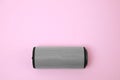 One portable bluetooth speaker on pink background, top view with space for text. Audio equipment Royalty Free Stock Photo