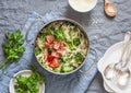One pot orzo primavera. Orzo pasta with asparagus, broccoli, green peas and cream in a saucepan. On a light background
