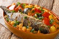 One-pot Thieboudienne Traditional West African Fish and Rice Dish with vegetables closeup in the dish. horizontal