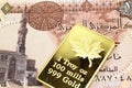 A one pound Egyptian pound note with a gold bar in macro Royalty Free Stock Photo