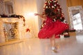 One pretty little girl with blonde hair wearing red, sparkly Christmas dress Royalty Free Stock Photo