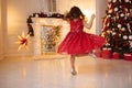 One pretty little girl with blonde hair wearing red, sparkly Christmas dress Royalty Free Stock Photo