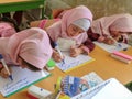 One of the primary school girls in Rasht, Guilan province, Iran. An Islamic school where girls should wear scarves and dress