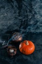 One pumpkin squash and copper or brass witch pots with candles Royalty Free Stock Photo