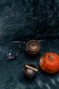 One pumpkin squash and copper or brass witch pots with candles Royalty Free Stock Photo