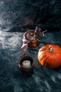 One pumpkin squash and copper or brass witch pots with candles Royalty Free Stock Photo