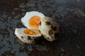 One quail egg open one still closed Royalty Free Stock Photo