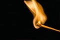 One quiet burning match on black background. Royalty Free Stock Photo