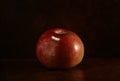 One red apple on table. Still life