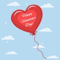 One red balloon with the text of congratulations on Valentine`s Day in the sky.