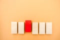 One red block stands out from the rest. Leadership and victory concept. Dissimilarity and dissent. Uniqueness initiative. Royalty Free Stock Photo