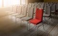 One red chair different from others in empty conference room Royalty Free Stock Photo