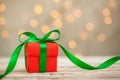 One red christmas gift box with green ribbon and copy space. Royalty Free Stock Photo