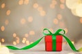 One red christmas gift box with green ribbon and copy space. Royalty Free Stock Photo