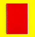One red colored note paper diary placed on a isolated yellow background Royalty Free Stock Photo
