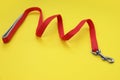 One red dog leash on yellow background Royalty Free Stock Photo