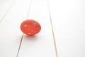 One red Easter egg on white wooden background Royalty Free Stock Photo