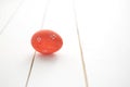 One red Easter egg on white wooden background Royalty Free Stock Photo