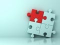 One red jigsaw puzzle piece stand out from the crowd different concept on light cyan wall Royalty Free Stock Photo