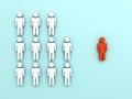 One red man standing alone separate from group of white people Royalty Free Stock Photo