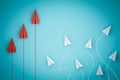 One red paper plane pointing in different way on blue background. Business for new ideas creativity and innovative solution Royalty Free Stock Photo