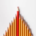 One red pencil leading similars crowd on white background Royalty Free Stock Photo