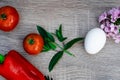 one red pepper. two tomatoes and one egg, violet, mint, objective photography