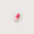 One red and pink pill Royalty Free Stock Photo