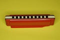 One red plastic old harmonica Royalty Free Stock Photo
