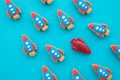 One red rocket fly opposite direction to other normal rocket on blue background. Think differently, standing out from the crowd Royalty Free Stock Photo