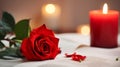 one red rose, candle on a white table, selective focus on flower