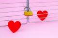 One red silk heart is in a cage locked with padlock and another one is outside. To meet a heartmate and to open heart for soulmate Royalty Free Stock Photo