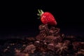 One red straberry on a dark chocolate Royalty Free Stock Photo