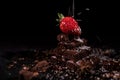 One red straberry on a dark chocolate Royalty Free Stock Photo