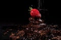 One red straberry on a dark chocolate Royalty Free Stock Photo